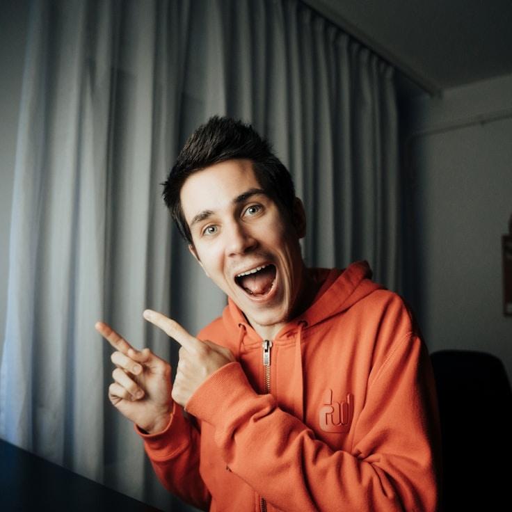 Kaveri Mehta, Lead Design Curator at CalmCopperRock, reviewing corporate floral arrangements